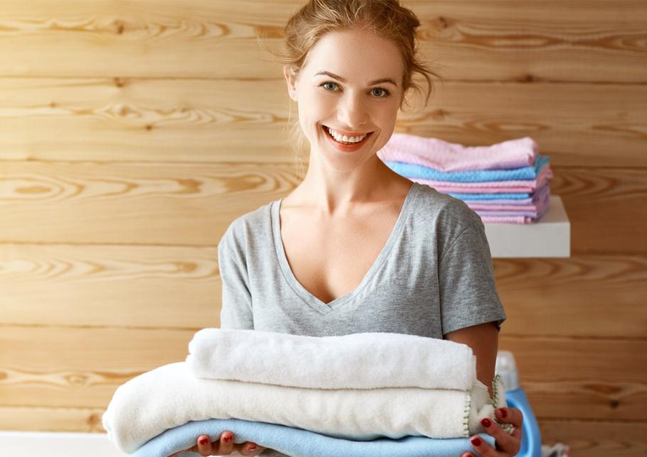 Smiling woman with laundry