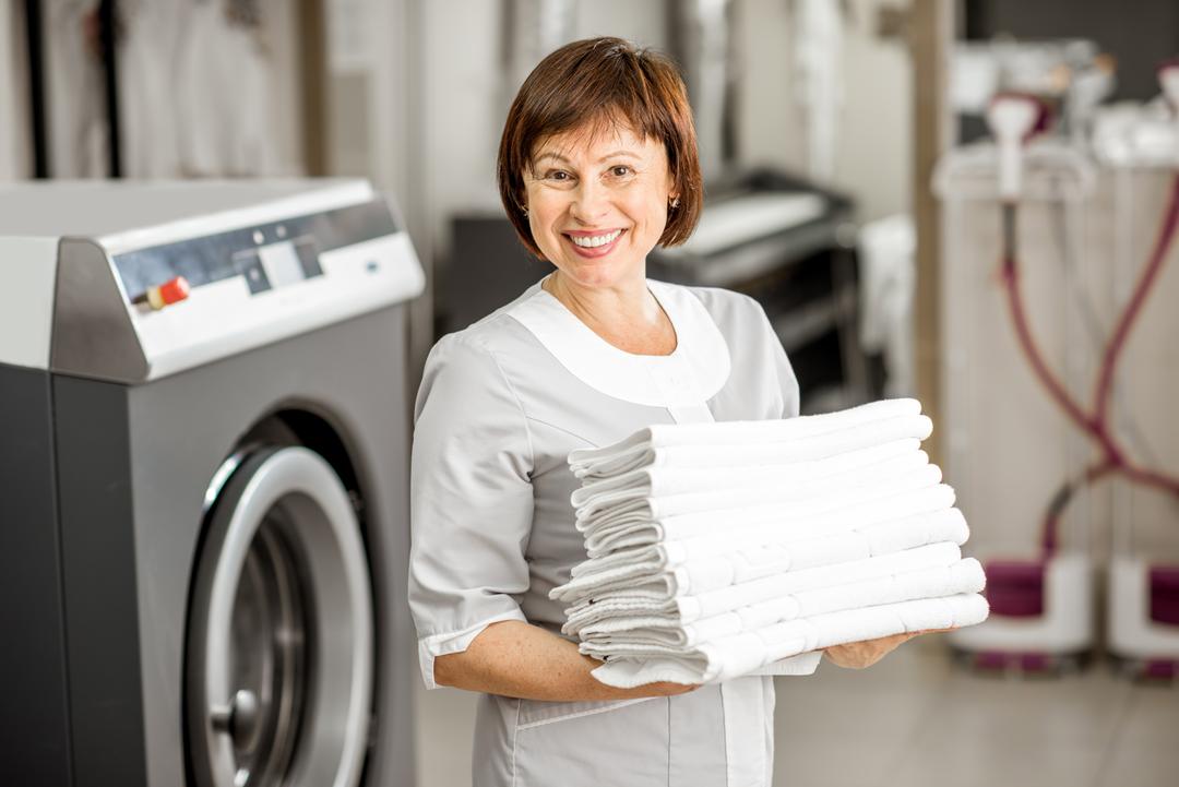 Smiling woman with laundry